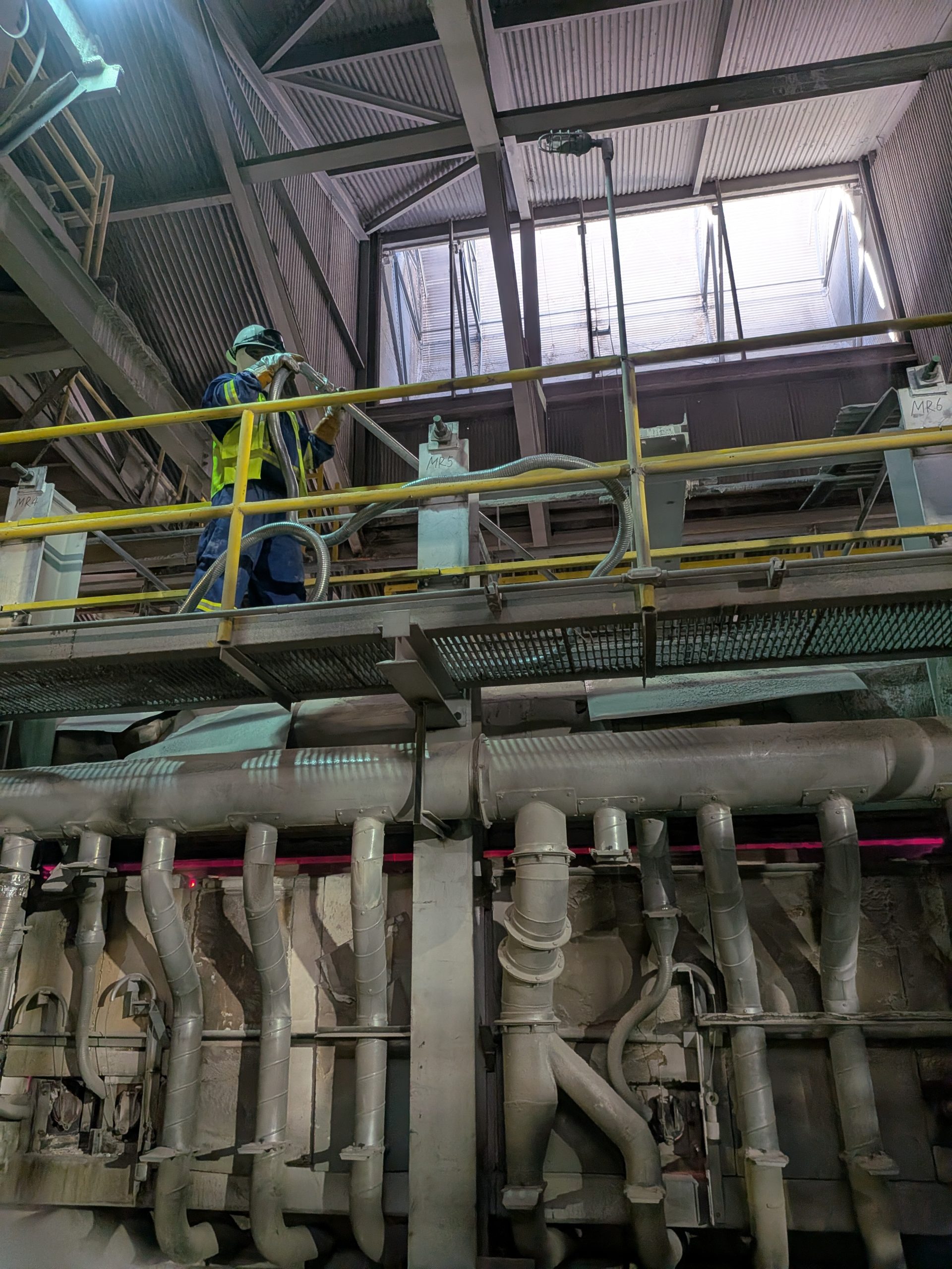 Cleaning a furnace in glass factory